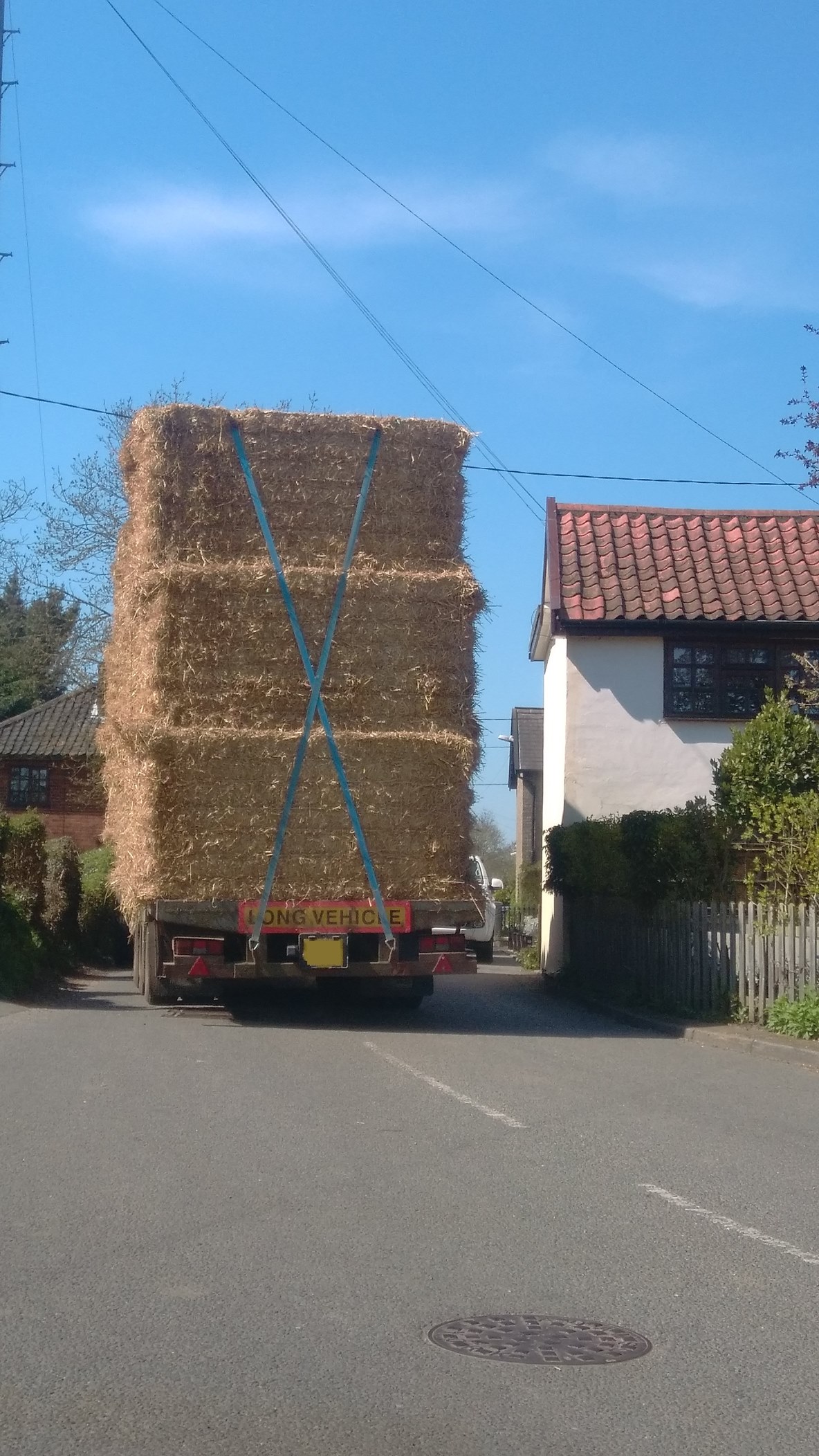 Large Agricultural Vehicle Filling Road